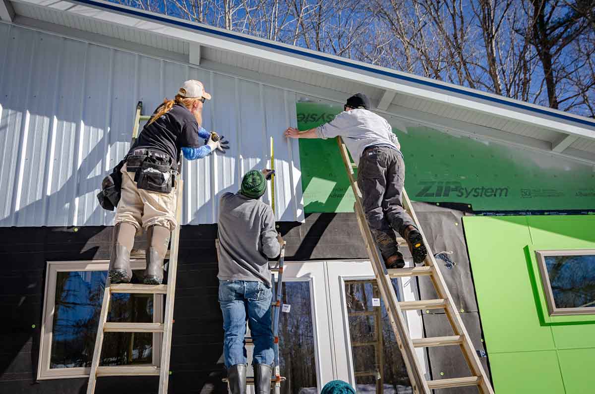 construction workers working on a house.