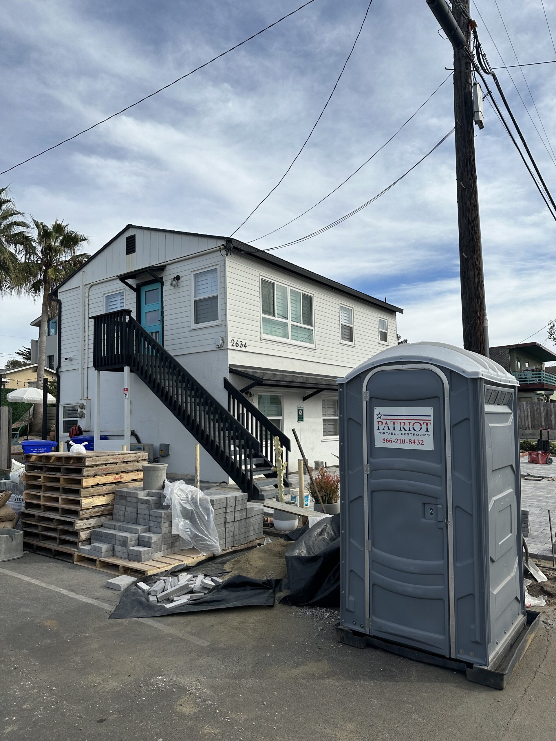 A Patriot Portable Restroom porta potty rental on a home construction site in Carlsbad, CA.
