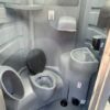 A picture of the interior of a flushable porta potty rental.