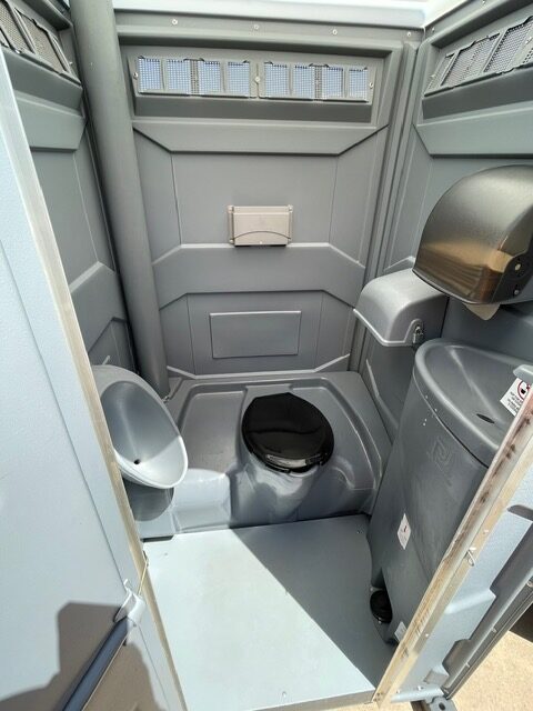 Deluxe sink porta potty rental unit interior.