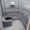 A picture of the interior of a wheelchair-accessible porta potty rental.