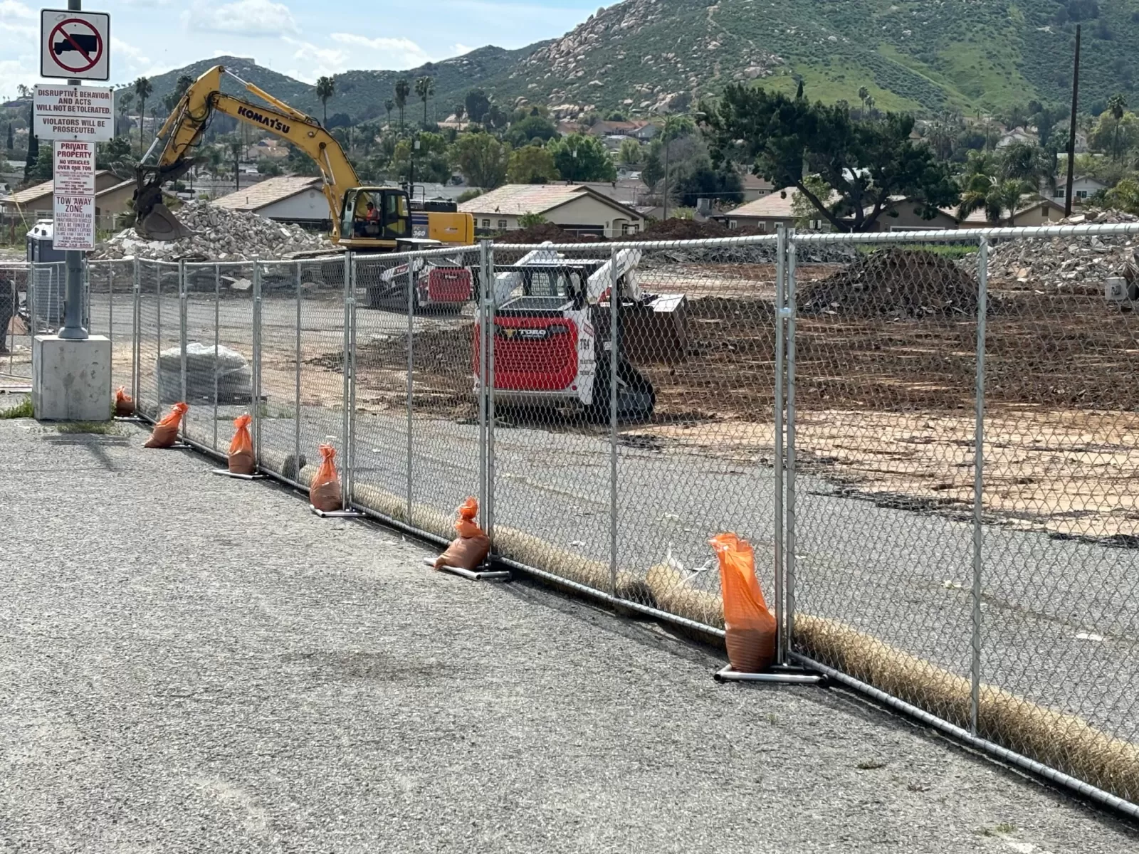 Portable toilet and temporary fencing at a Southern California construction site