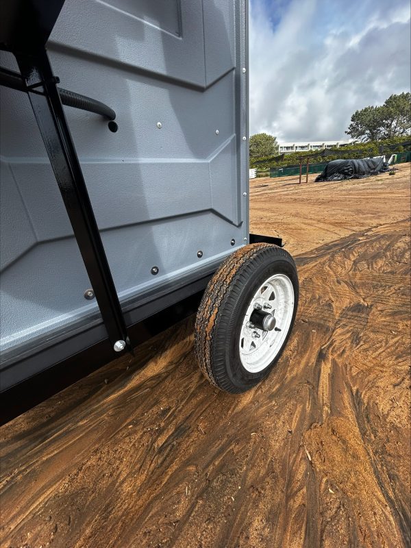 A picture of the wheel on the towable porta potty rental unites.