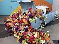 Classic car decorated with flowers at a San Diego event