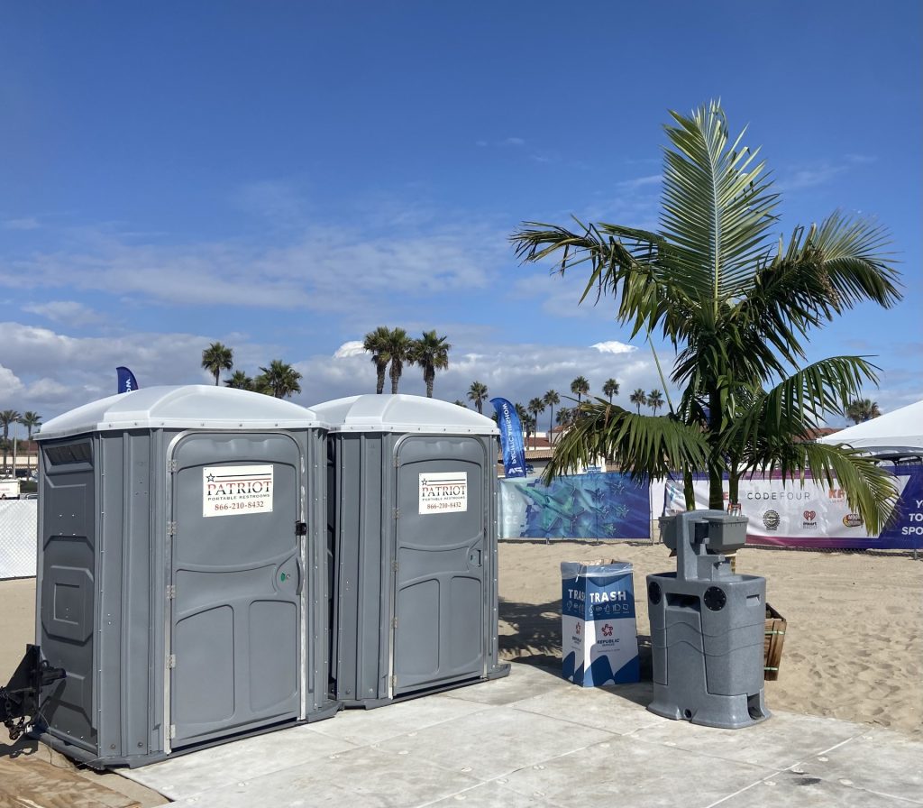 Porta potty rental units on the beach in Orange County