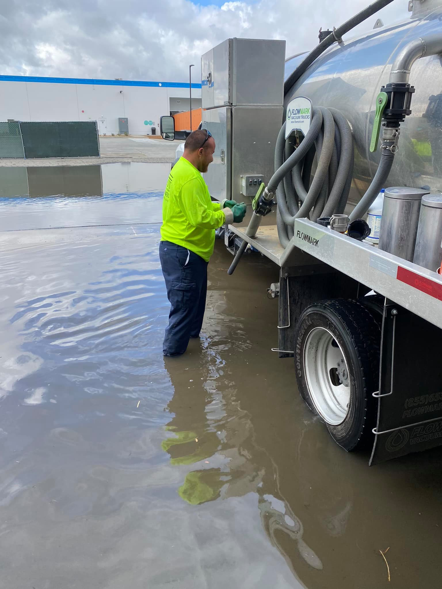 One of our employees getting ready to pump some of our rentals and clean them during a flood.