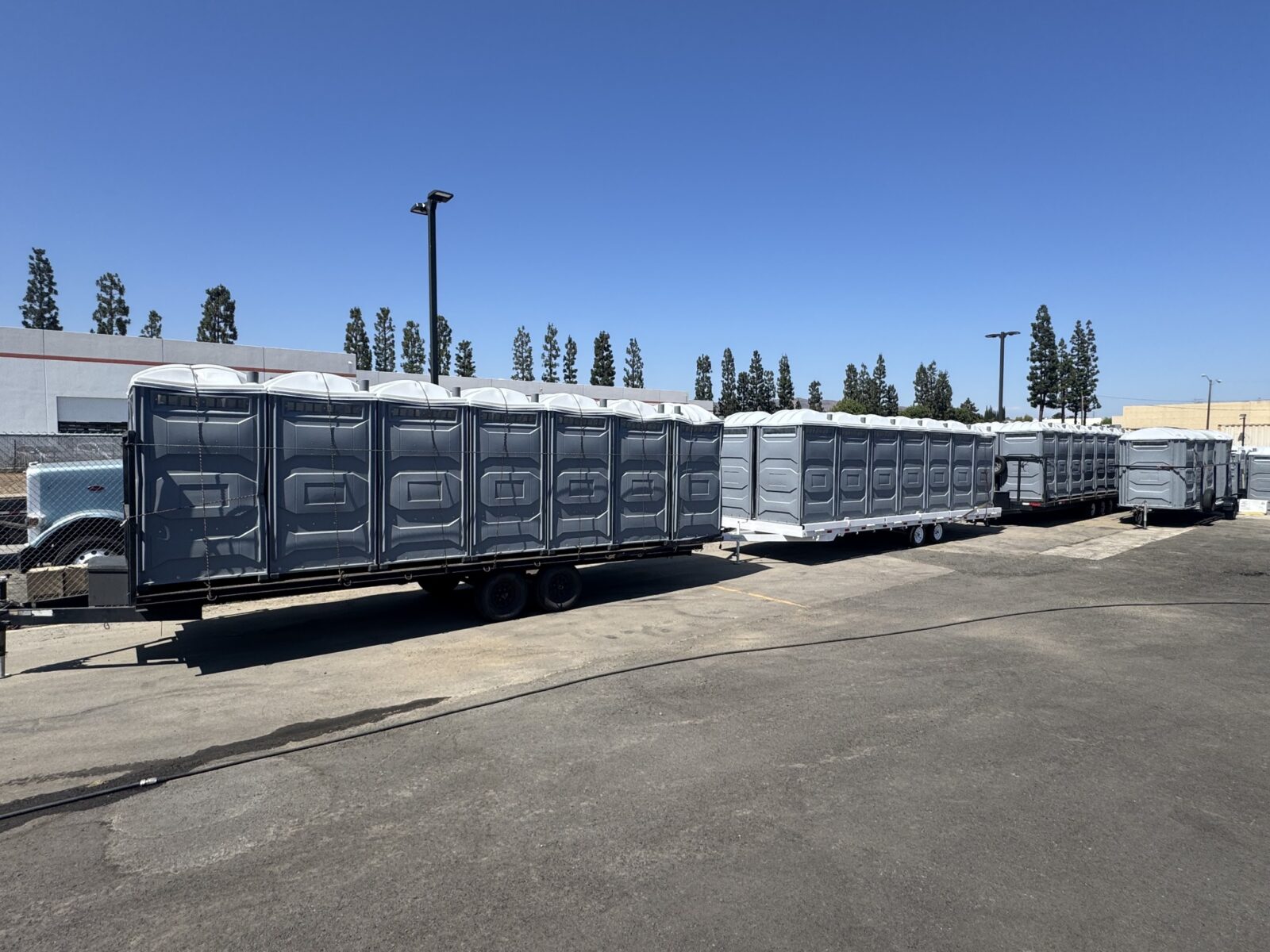 Row of portable toilets staged for a large deployment