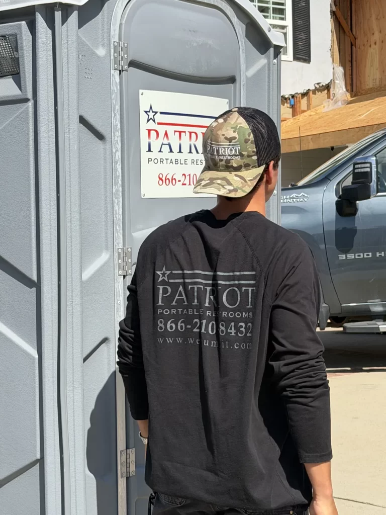 Patriot Portable Restrooms branded team member on-site